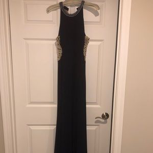 Navy blue prom dress with high neck line and train